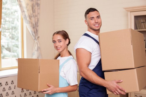Local man and van team preparing items for delivery in Thehyde