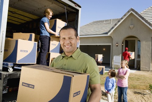 Local removals experts handling furniture during house removals in Thehyde